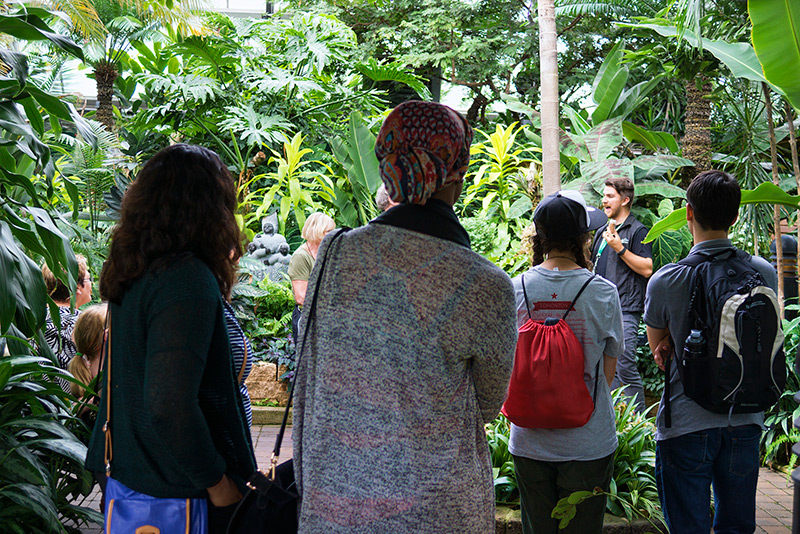 A guide leading children on a tour of Muttart's pyramids.
