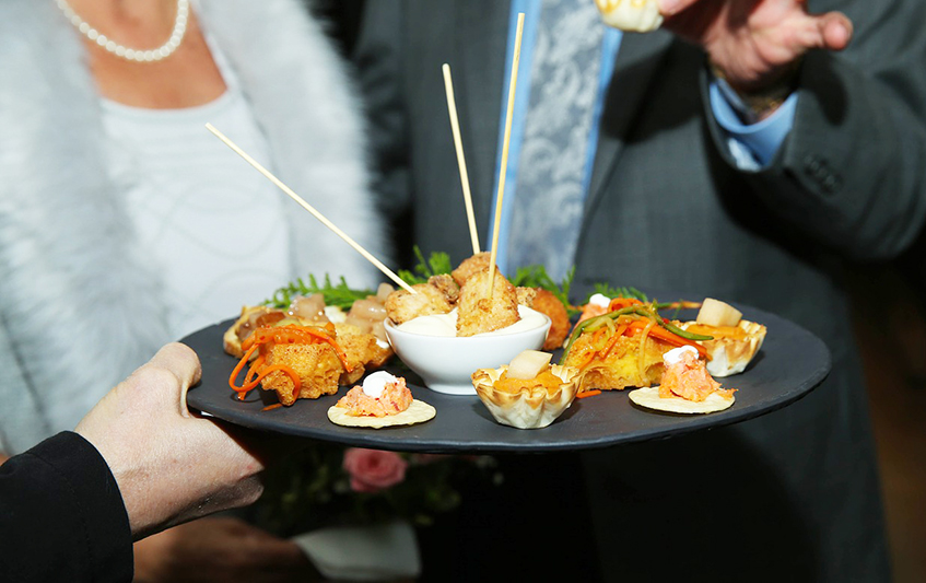 Tray of hors d'oeuvres being served at an event