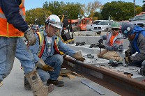 Workers at railway tracks