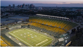 Aerial view of Commonwealth Stadium at dusk.