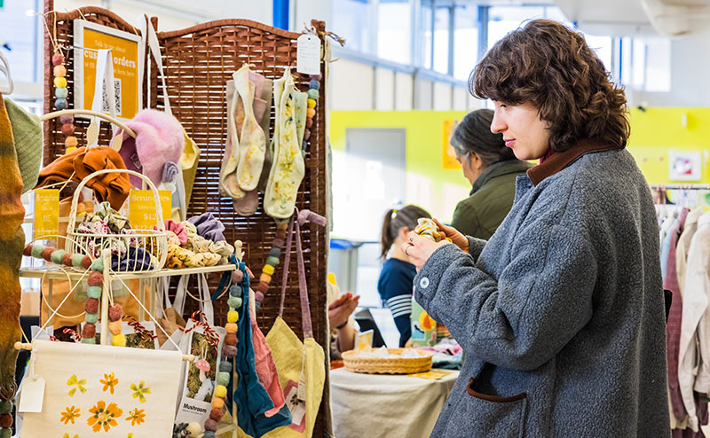 person-standing-at-vendor-craft-stall