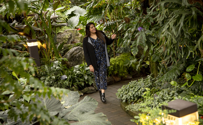 A person exploring a pyramid at the Muttart