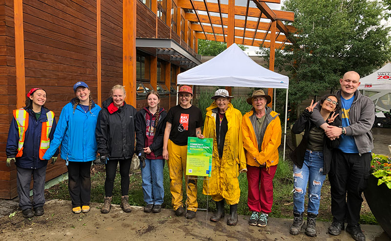 A group of volunteers at a weed pull event.