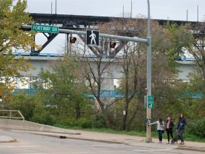 people pushing a button before crossing the street
