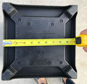 Showing the underside of a container with a measurement of 10 inches