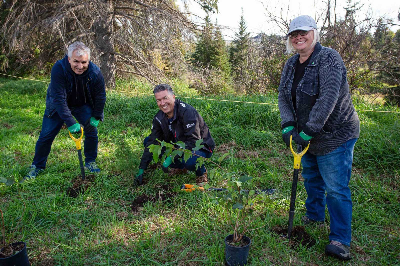 Volunteers at a Root for Trees planting event