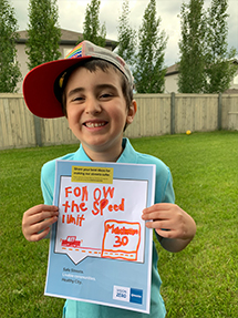 Young man holding a Vision Zero sign 
