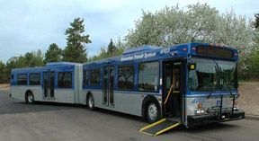 Photo of an articulated bus with the ramp extended