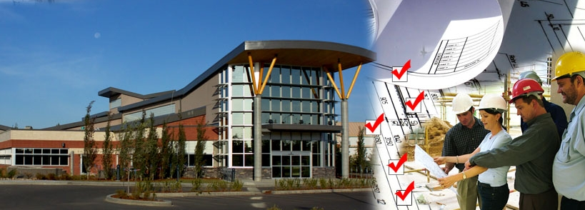 Photo showing Lois Hole Library and people reviewing blueprints.