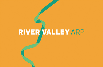 A graphic of a ribbon with "River Valley ARP" in text.