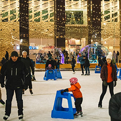People ice skating at City Hall Plaza 