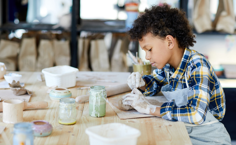 A child working with clay.