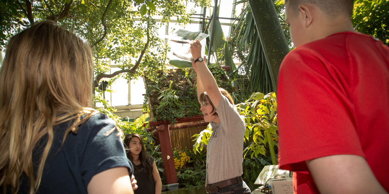 An instructor presenting a program in a pyramid at the Muttart.