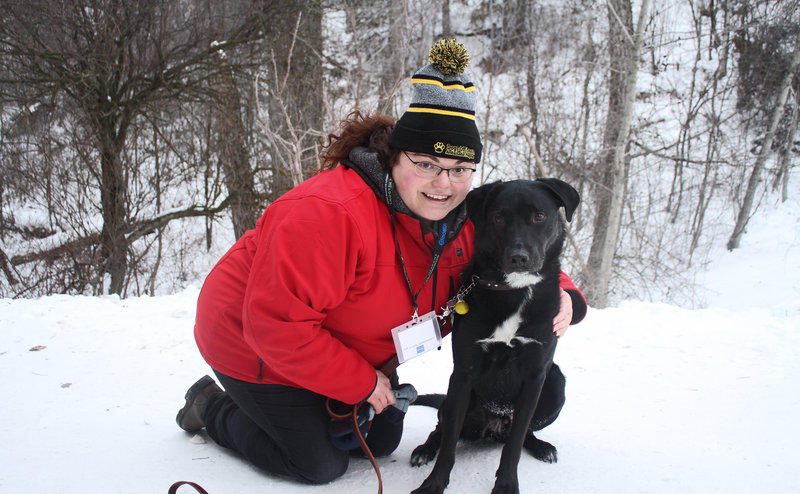 woman with dog in snow