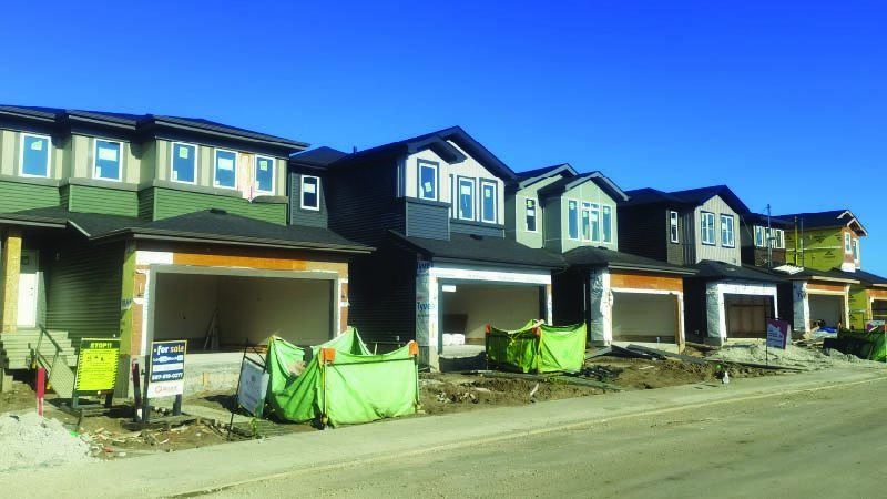 Growth monitoring photo of homes under construction.