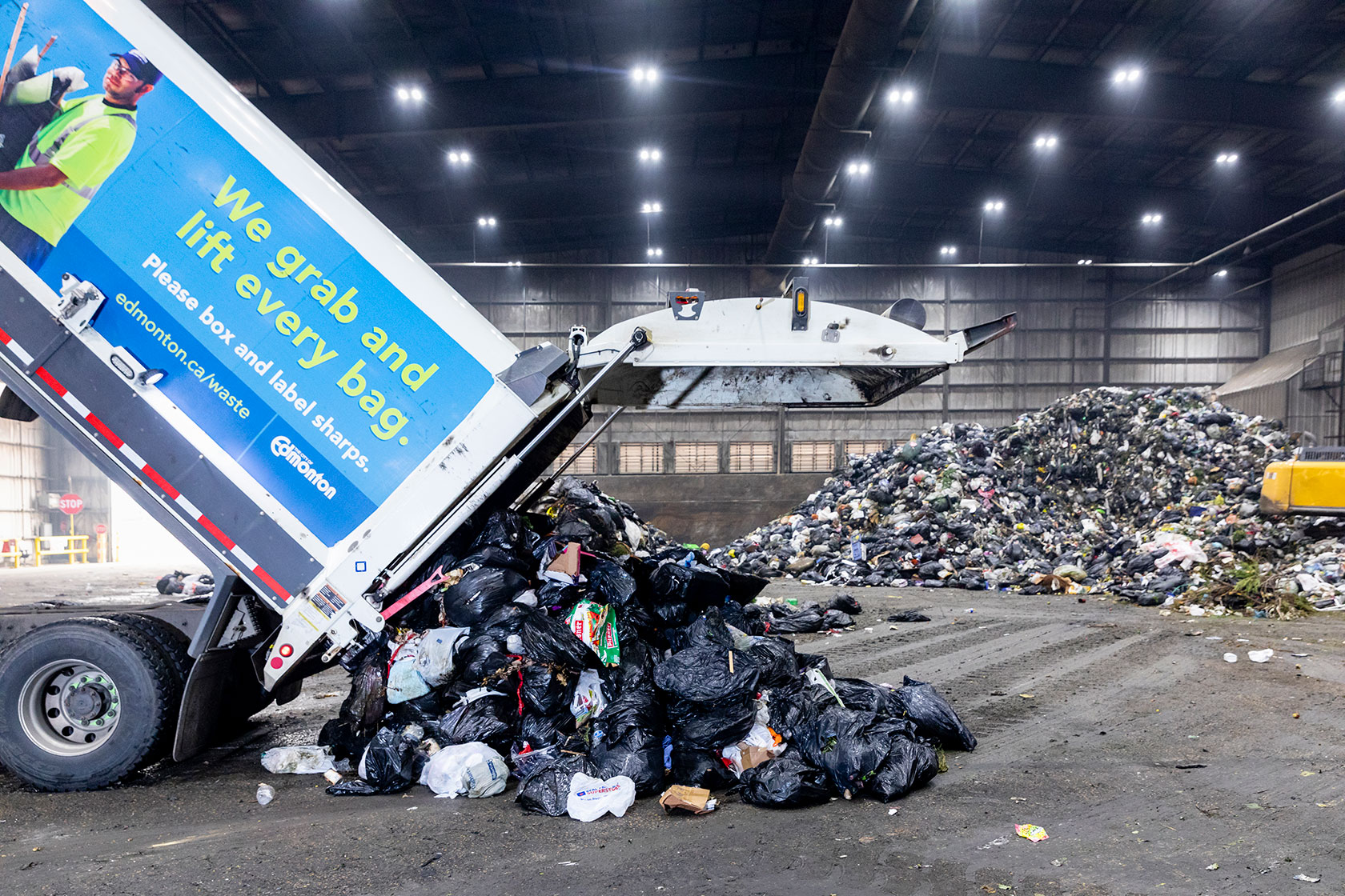 Garbage is tipped on the floor of the Integrated Transfer and Processing Facility