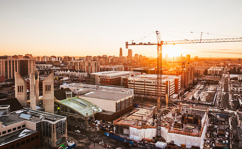 Aerial view of downtown construction at sunset