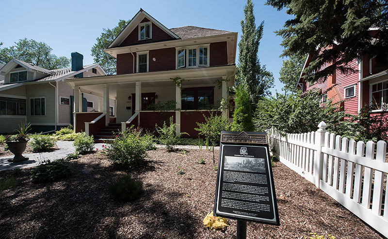 red house with white trim