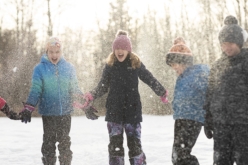 People skating on a park trail.