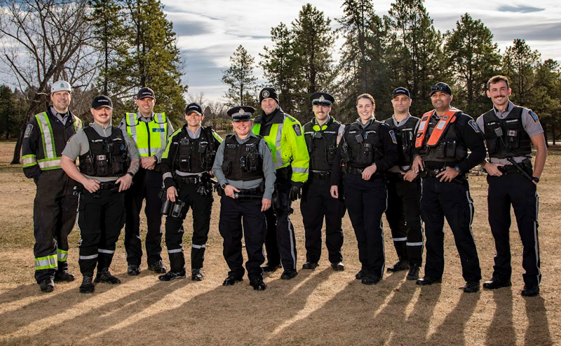 many uniformed officers standing in a line