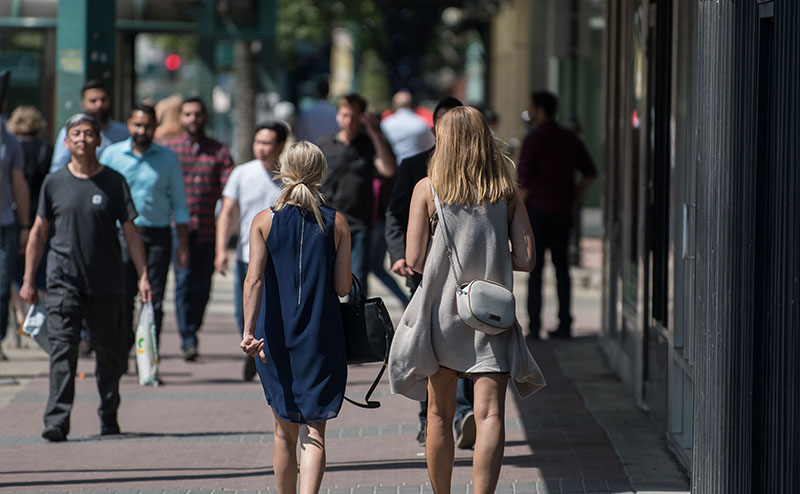 people walking on street downtown
