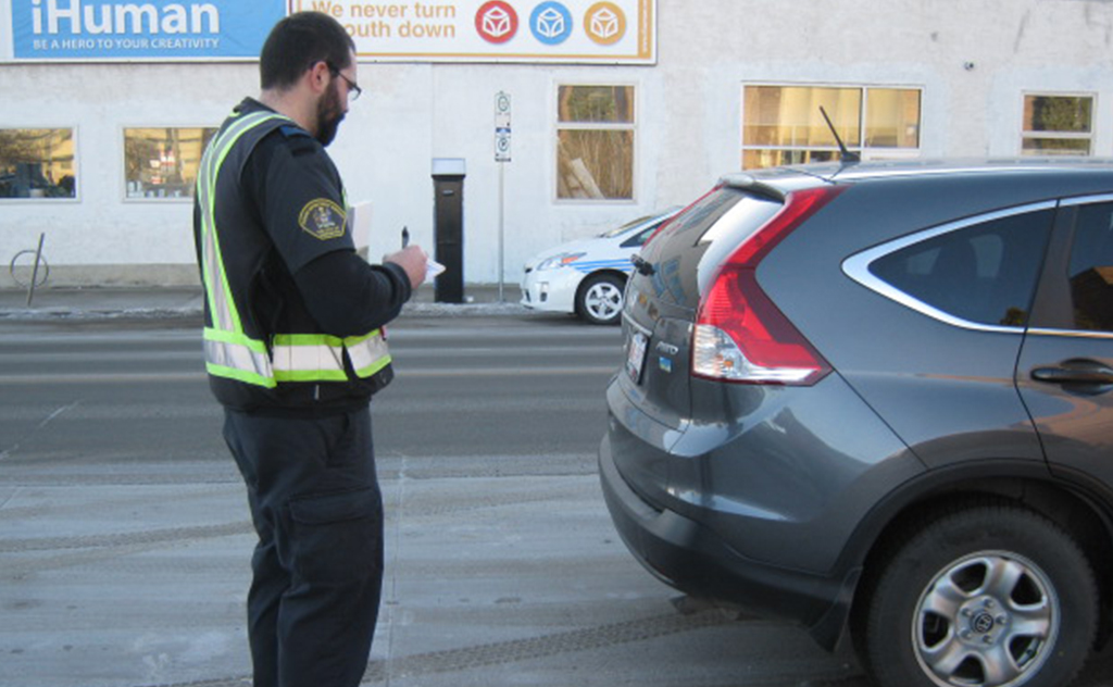 officer writing a ticket