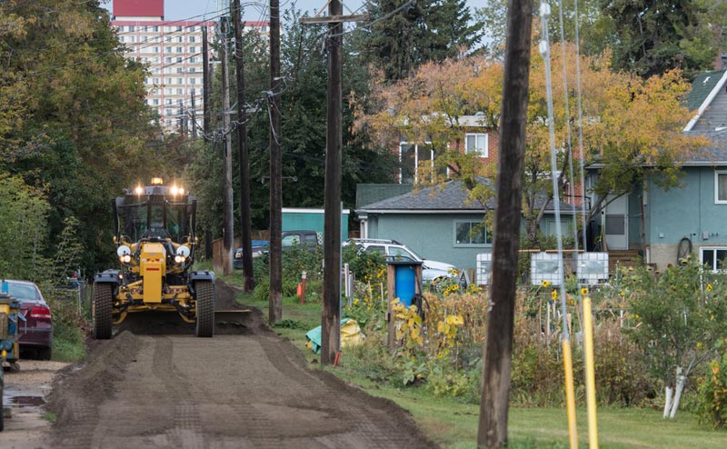 An alley being graded in preparation for paving