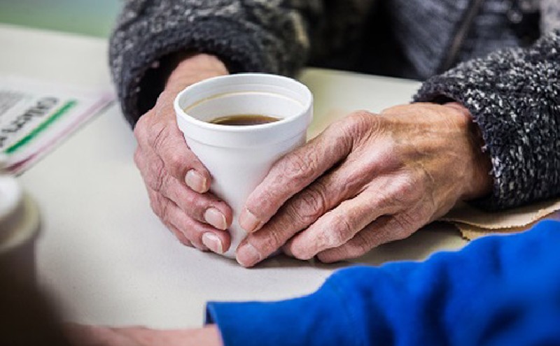 hands holding a cup