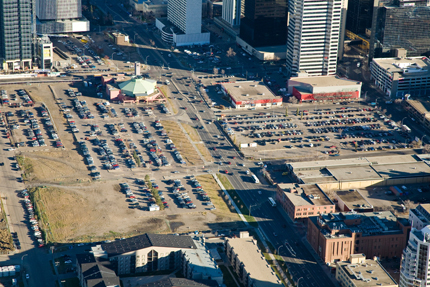 aerial view of land with parking lots