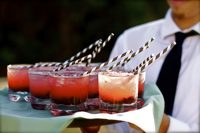 Waiter carrying a tray of drinks