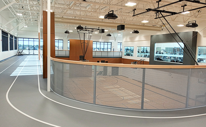 Photo of running track overlooking gymnasium.