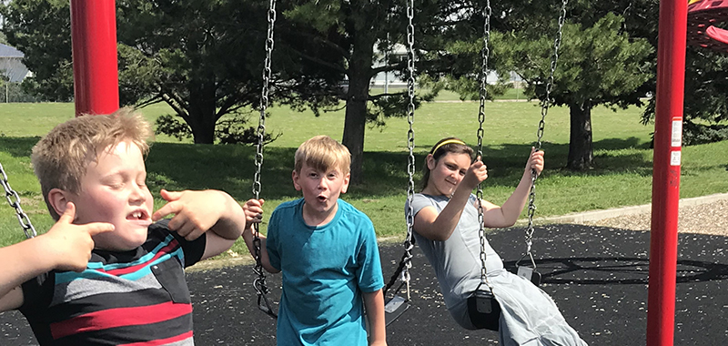 Kids playing on a swing