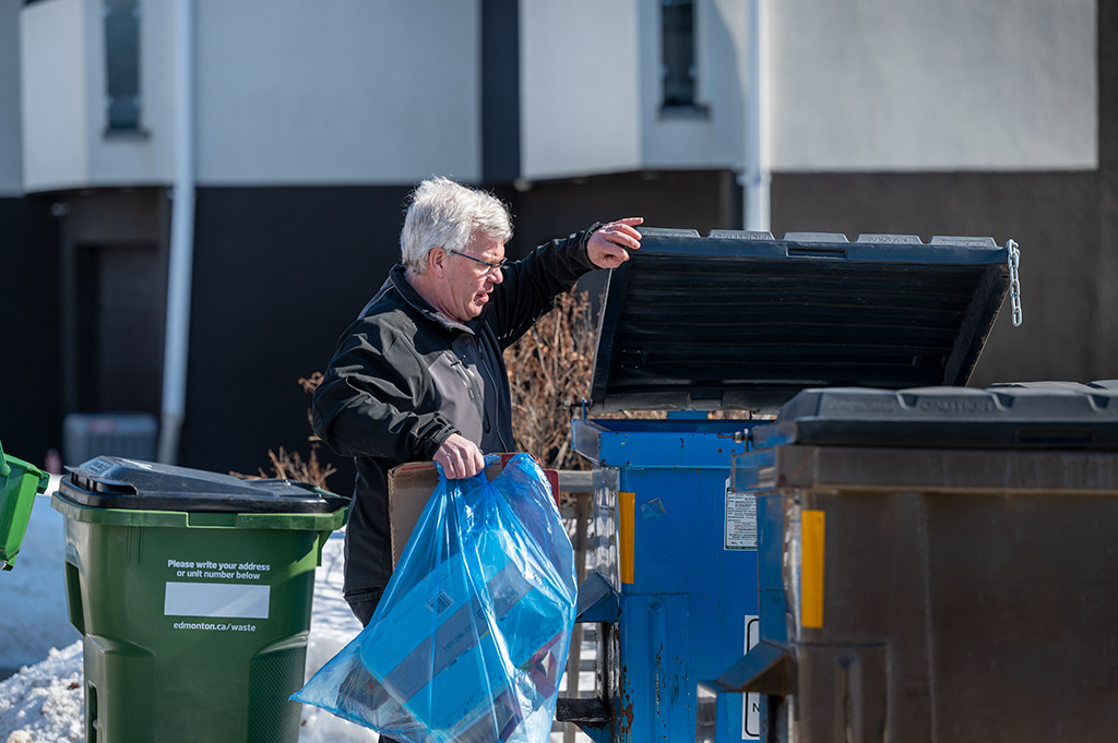 man beside bin