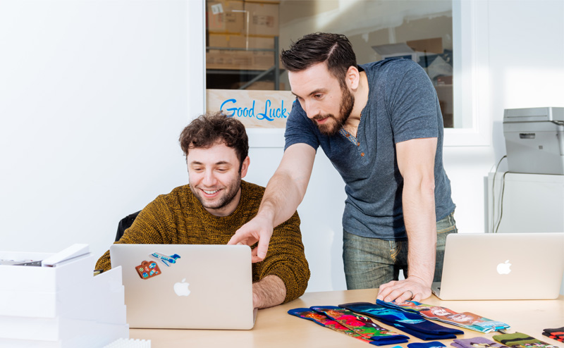 two men working on computer