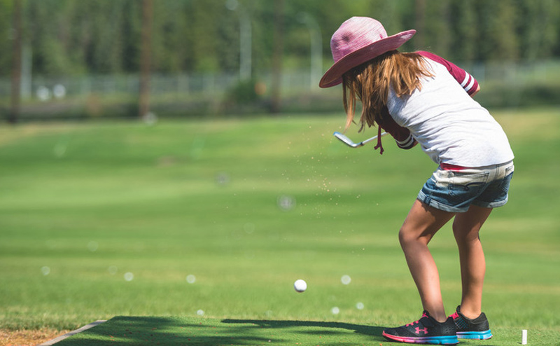 child playing golf