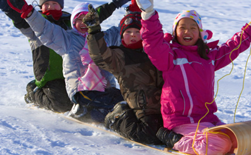 Kids tobogganing