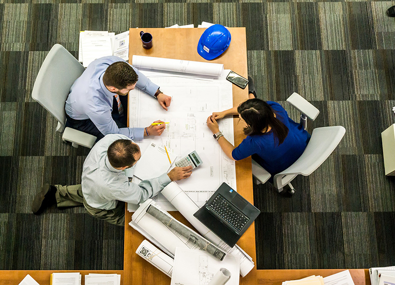 Image of staff working on a blueprint