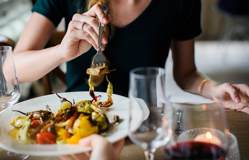 A woman eating a salad