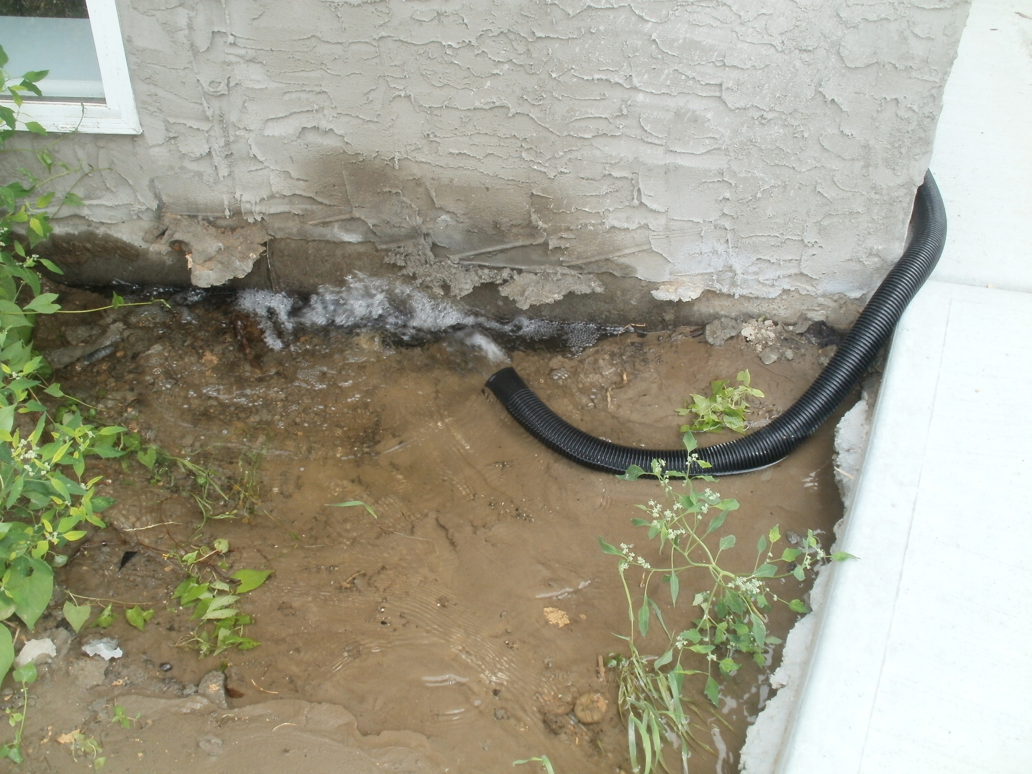 Re-circulation of Ground Water Due to Settlement and Sump Pump Hose Location