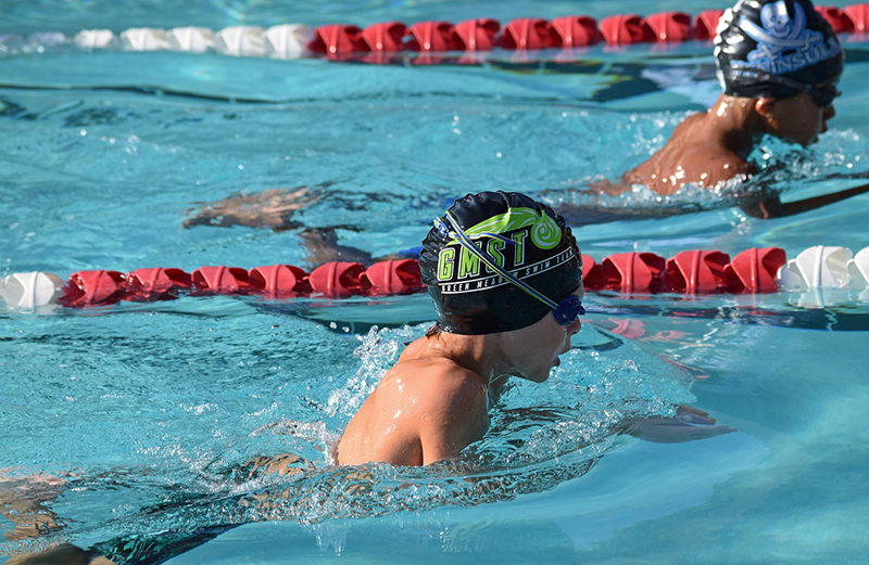 Young swimmer in their lane during a race