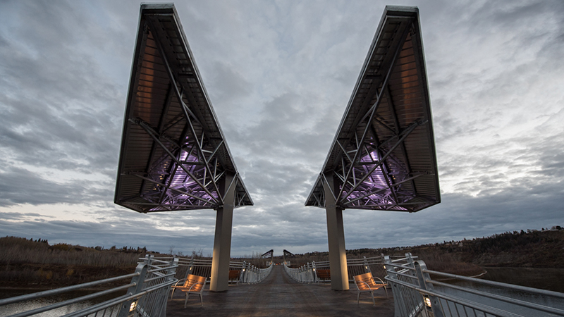 View of the Terwillegar Park Footbridge at dusk showing the lighting