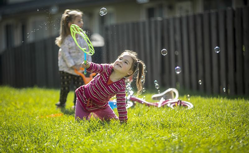 girls playing in grass