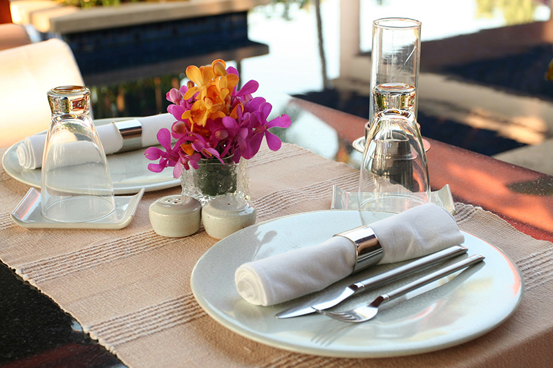 Photo of a table with place settings for a party.