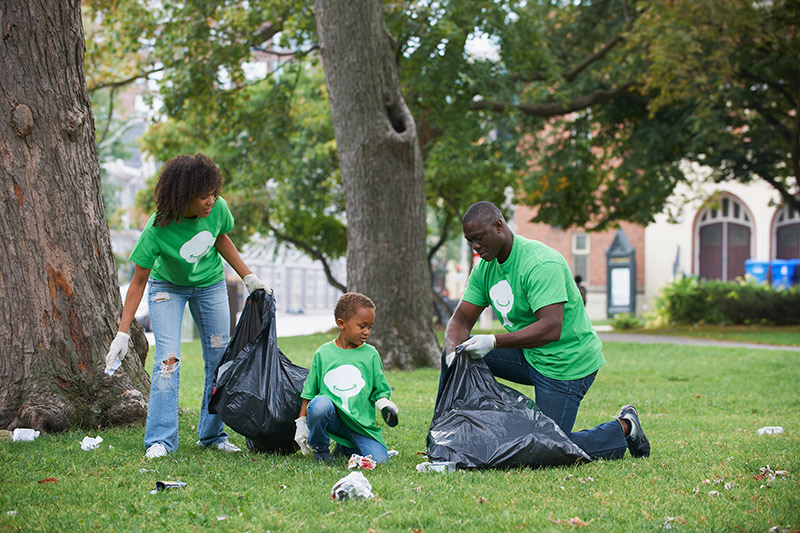 family picking up litter