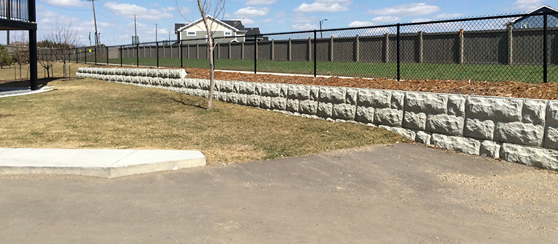 Graded driveway next to a retaining wall