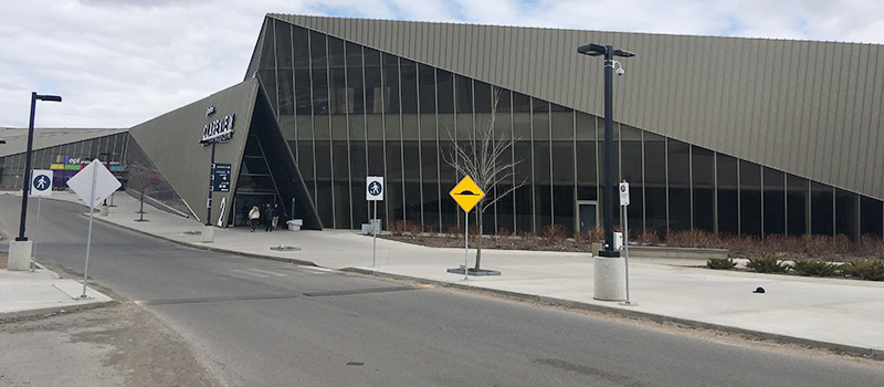 Graded road and walkway in front of Clareview Recreation Centre