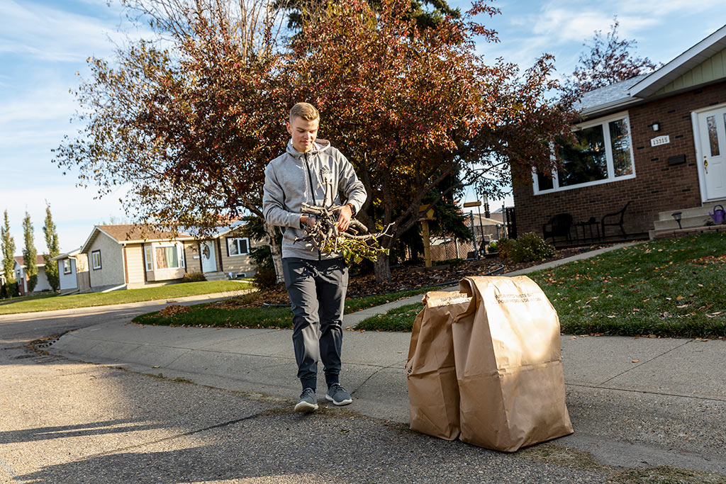 man with yard waste