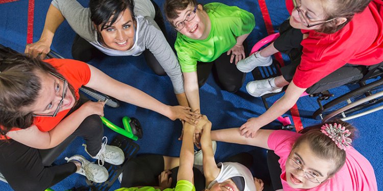 persons of diverse abilities holding hands