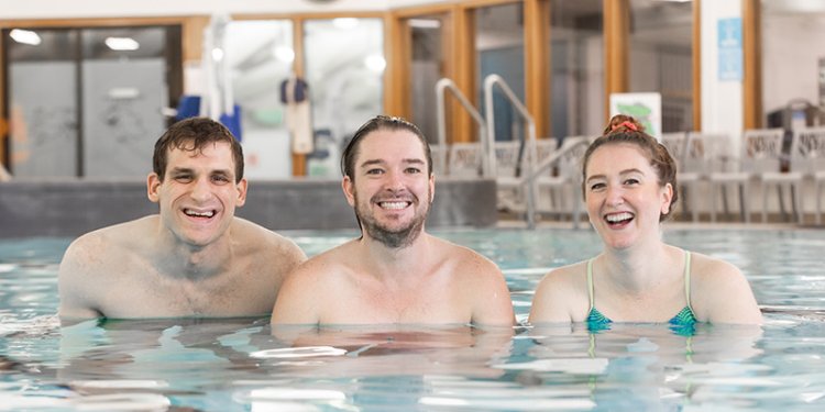 3 persons in pool swimming