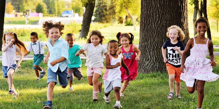 diverse children running in park